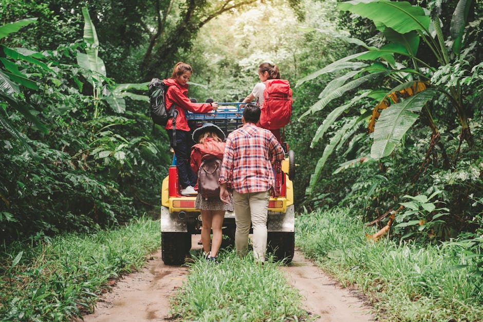 Friends hiking in a tropical forest, riding a jeep with backpacks, enjoying the adventure.