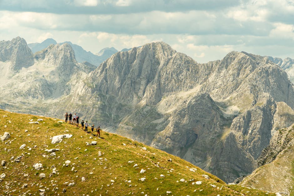 Explore the stunning landscapes of Shkodër County, Albania with a group of hikers in the picturesque mountains.